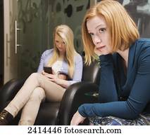 Candidates waiting for a job interview in a lobby; Edmonton, Alberta, Canada