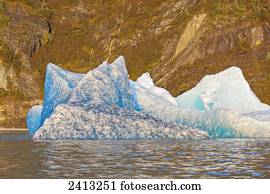 Iceberg broken off from the retreating Mendenhall Glacier floating in Mendenhall lake; Juneau, Alaska, United States of America