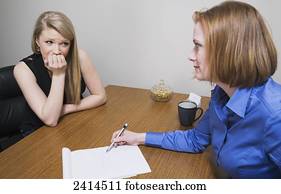 Intern receiving job evaluation from a superior; Edmonton, Alberta, Canada