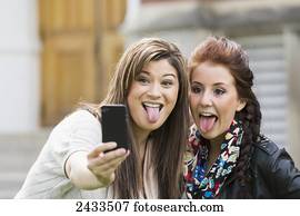 Two friends doing self-portrait to the camera; Edmonton, Alberta, Canada