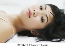 Close-Up Of A Beautiful Asian Woman Laying Down.