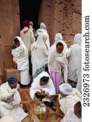 Ethiopia, Ethiopian Orthodox pilgrims making money offerings in the courtyard of A