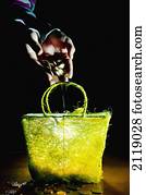 United Kingdom, England, Money poured into yellow basket; Esher