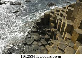Black Basalt Columns Sticking Out Of The Sea, Giant's Causeway, Northern Ireland, United Kingdom
