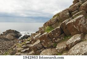 Black Basalt Columns Sticking Out Of The Sea, Giant's Causeway, Northern Ireland, United Kingdom
