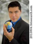 Business Man Holding The World In His Hand