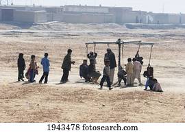 Children Playing At A Merry-Go-Round In Kabul,, Afghanistan