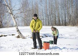 Natives Ice fishing in Kotzebue Western Alaska winter Stock Image | 015ic_ab0006_002 | Fotosearch