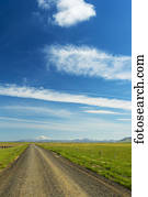 Looking down gravel road to Hekla volcano in the distance; Iceland