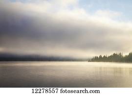 Low cloud and mist on Lake Whatcom at sunrise; Bellingham, Washington, United States of America