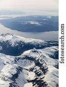 Aerial view of snow capped mountains above the city of Ketchikan, Southeast Alaska, USA, Winter
