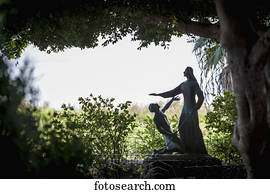 On the Sea of Galilee, a statue beside the Church of St Peter's Primacy depicts Jesus after his death and Resurrection, appearing before St. Peter; Galilee, Israel