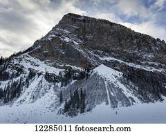 Rugged mountain with snow in winter; Lake Louise, Alberta, Canada