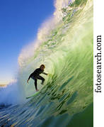 Surfer On Blue Ocean Wave