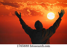 Man lifts hands towards the heavens Man lifts hands towards the heavens