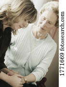 Senior and Woman praying