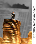 Man standing on a stack of money