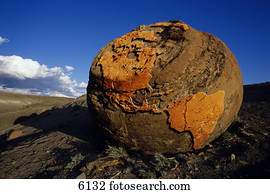Large boulder with relief of north America on surface