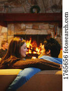 Couple in front of a fireplace