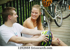 Couple taking a break after bike ride