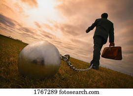 Businessman with ball and chain