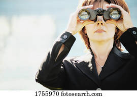 Businesswoman looks into the future Businesswoman looks into the future