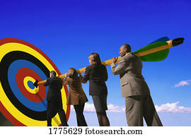 Businesspeople putting arrow on target Businesspeople putting arrow on target