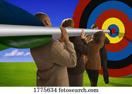 Businesspeople with arrow aiming at target Businesspeople with arrow aiming at target