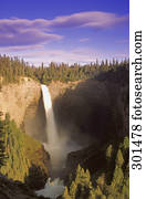 Narrow waterfall in forest gully