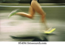 Blurred image of runner on road