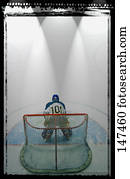 Hockey goalie in crease