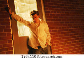 Man stands in door frame