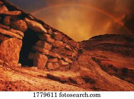 An empty tomb with a rainbow