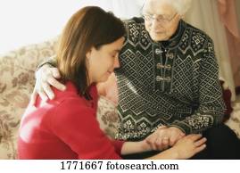 Senior and Woman praying