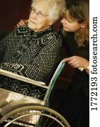 Elderly lady being comforted