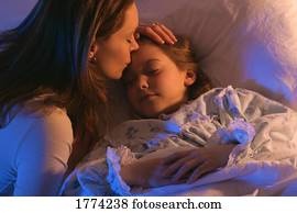 Mother with sleeping daughter