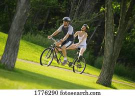Happy couple on a tandem bike