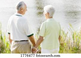 Senior couple by the river Senior couple by the river