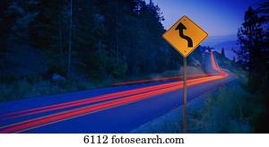 Time delay of vehicles on mountain road at dusk