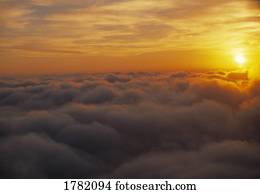 Cloud tops with rising sun