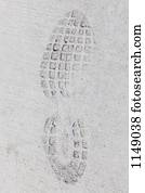 Imprint of a sports shoe in concrete