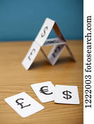 A house of cards of various currency