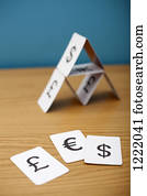 A house of cards of various currency