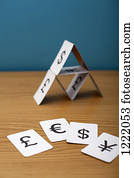 A house of cards of various currency