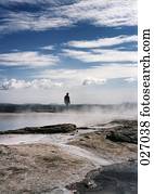 Person standing on a volcanic landscape