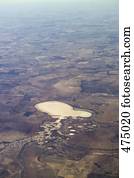 Aerial view of salt lakes within a rural landscape