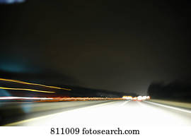 Multiple lane highway, night, non-urban scene