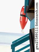 Lifeguard float hanging on a lifeguard hut