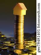 Model home on a stack of coins