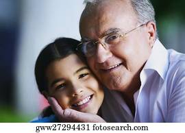 Portrait of a senior man smiling with his granddaughter